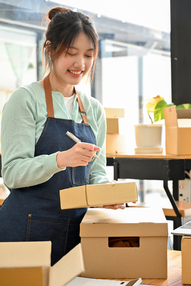 Millennial Woman Startup E-Commerce Business Shop Owner Packing